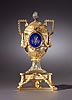 A Louis XVI paste, silver and enamel mounted ormolu wo handled vase